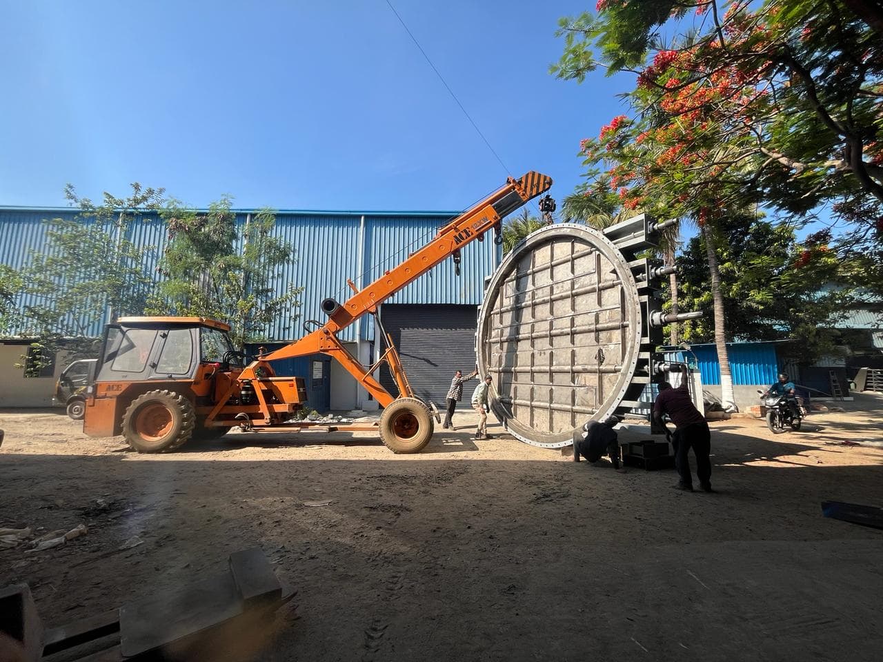 ACE crane picking a louver gate off the trailer
