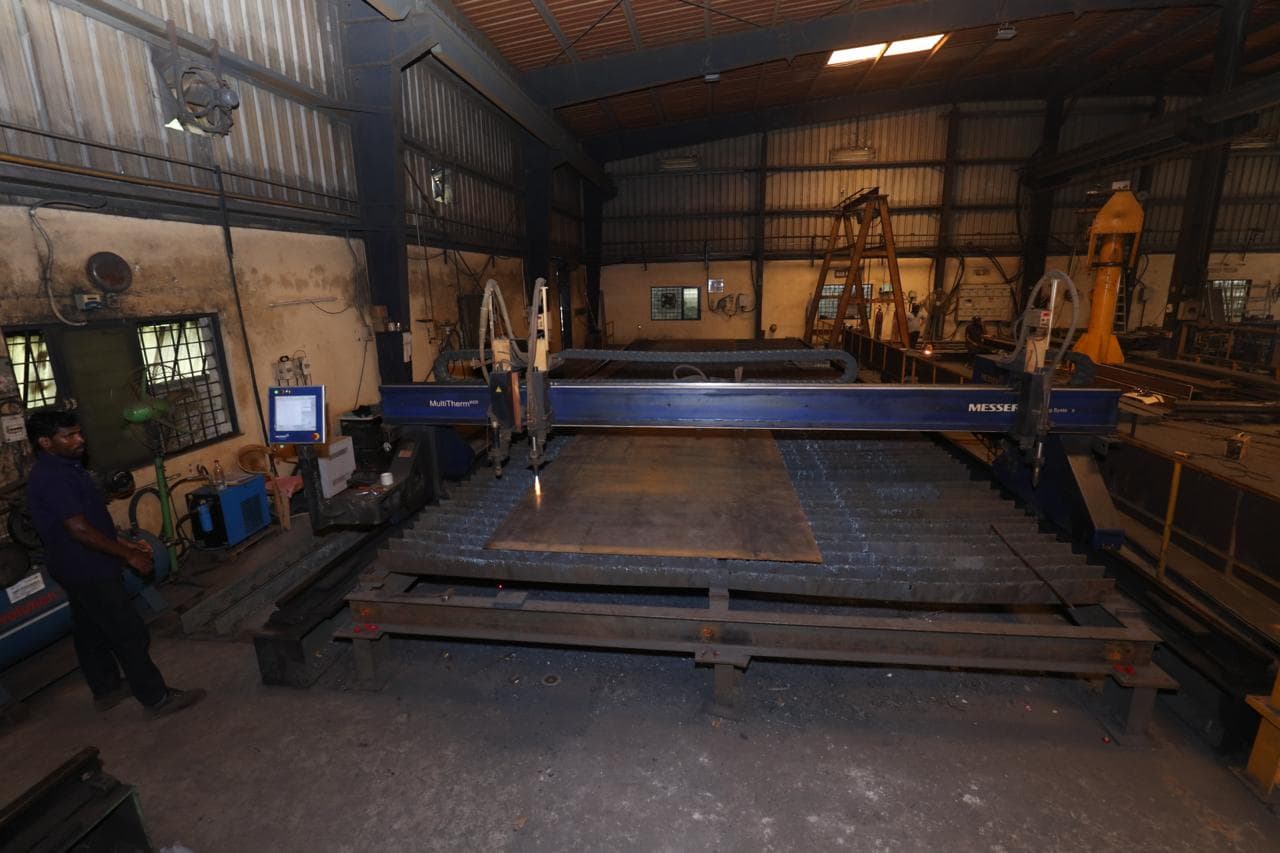 Damper frame with pivot bosses welded in